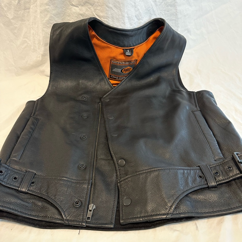 Leather vest- no patches on it- worn 3 times